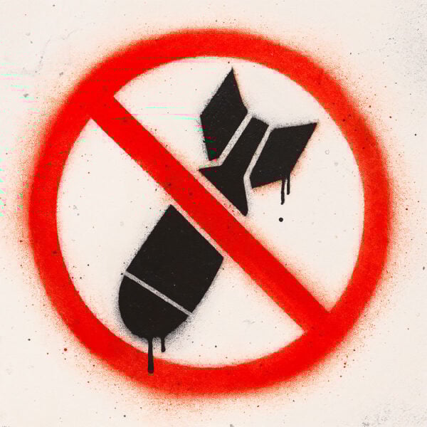Stencil showing a black bomb crossed out with a red line in a red circle, a striking anti-war symbol created in a street art style with dripping paint.
