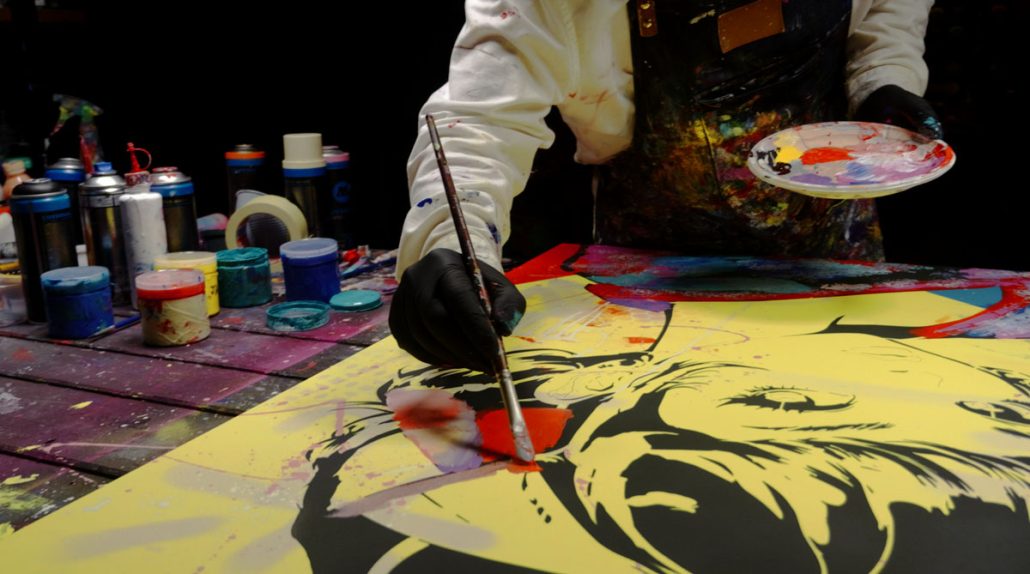 Painting the hair knot with expressive textures, splashes, and layered effects