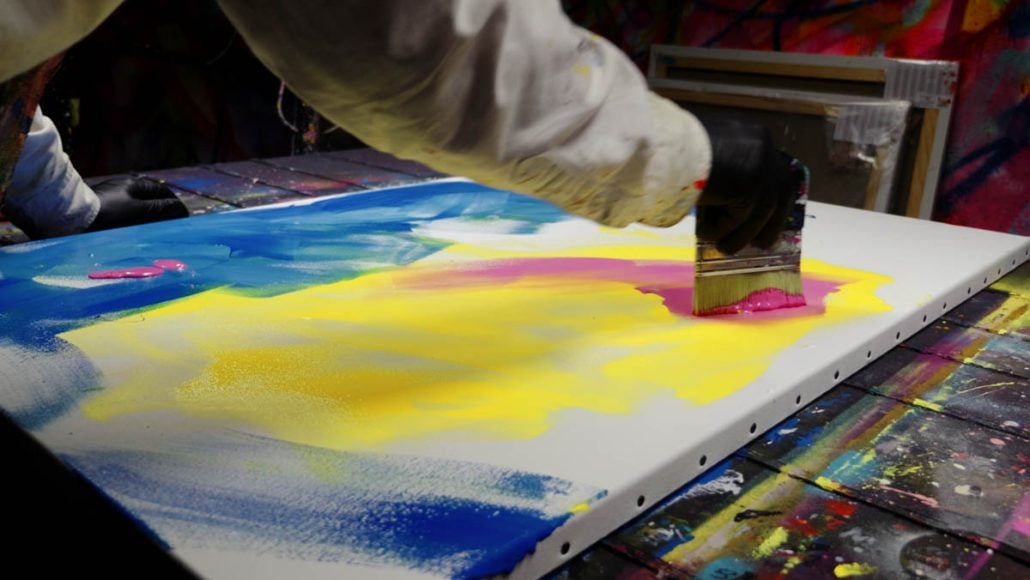 Creating the colorful street art background with a brush, splashes and drips before using the Van Gogh Punk stencil