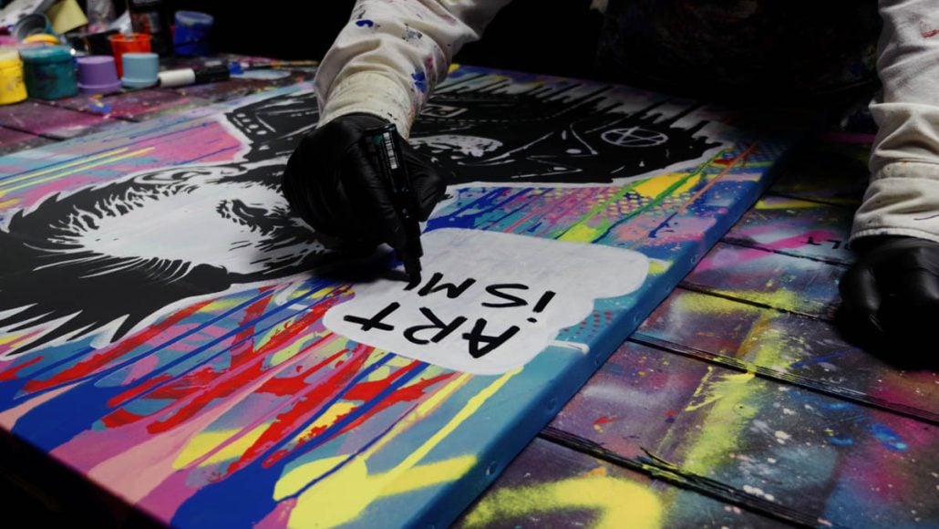 Punk slogans painted around the Van Gogh Punk portrait on street art canvas